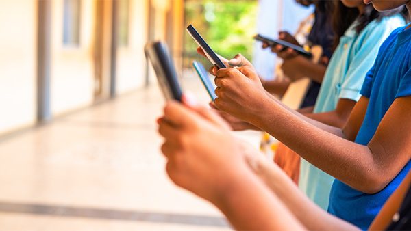 group of people looking at cellphones